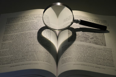 Photo of Book with Magnifying Glass, Heart